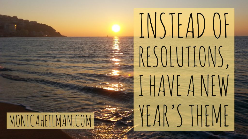 New Years Theme Title Image with sunrise in background and text that reads "Instead of Resolutions, I Have a New Year's Theme"